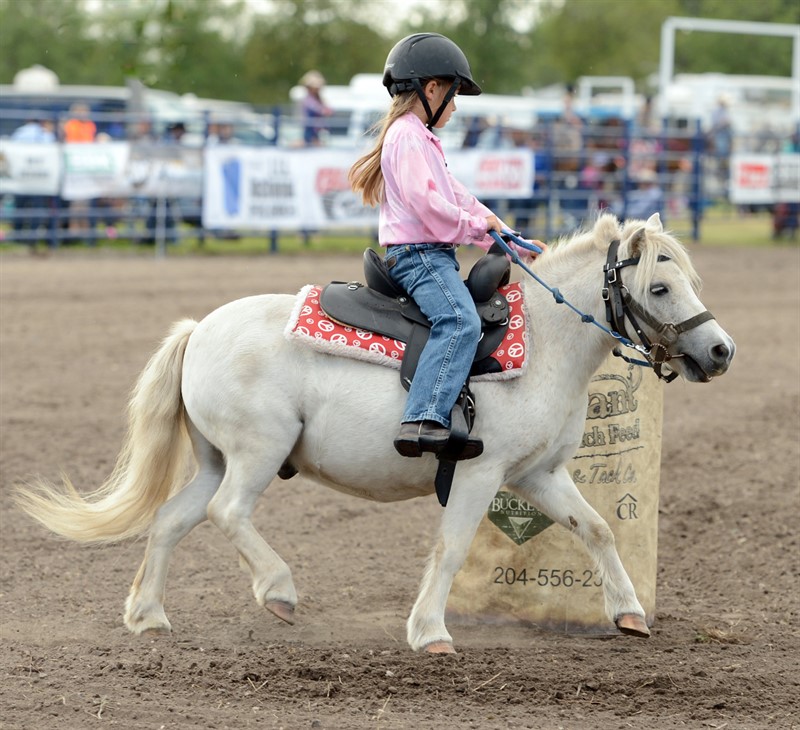 Girl riding a pony